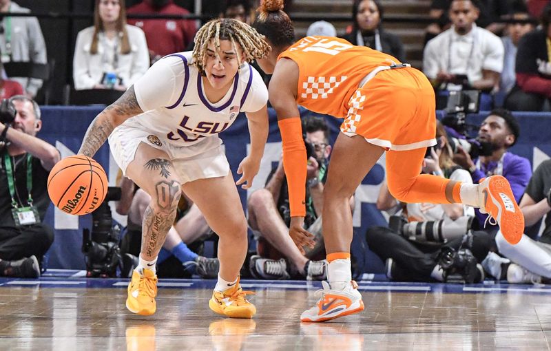 Mar 4, 2023; Greenville, SC, USA; LSU guard Kateri Poole (55) takes a ball away from Tennessee guard Jasmine Powell (15) during the first quarter at Bon Secours Wellness Arena. Mandatory Credit: Ken Ruinard-USA TODAY Sports