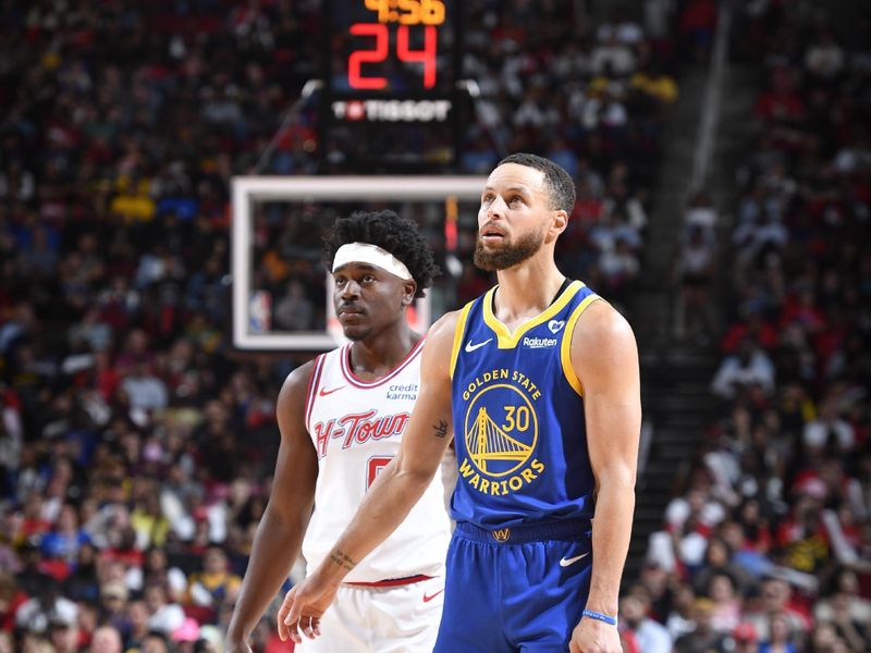 HOUSTON, TX - APRIL 4: Stephen Curry #30 of the Golden State Warriors and Aaron Holiday #0 of the Houston Rockets look on during the game on April 4, 2024 at the Toyota Center in Houston, Texas. NOTE TO USER: User expressly acknowledges and agrees that, by downloading and or using this photograph, User is consenting to the terms and conditions of the Getty Images License Agreement. Mandatory Copyright Notice: Copyright 2024 NBAE (Photo by Logan Riely/NBAE via Getty Images)