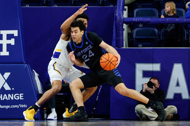 Jan 13, 2024; Colorado Springs, Colorado, USA; Air Force Falcons guard Jeffrey Mills (24) controls the ball as San Jose State Spartans guard Myron Amey Jr. (0) guards in the second half at Clune Arena. Mandatory Credit: Isaiah J. Downing-USA TODAY Sports