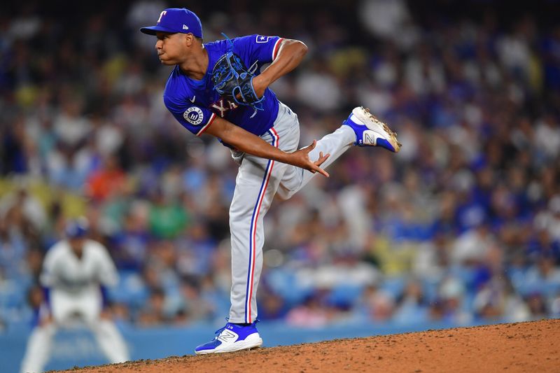 Jun 12, 2024; Los Angeles, California, USA; Texas Rangers pitcher José Leclerc (25) throws against the Los Angeles Dodgers during the sixth inning at Dodger Stadium. Mandatory Credit: Gary A. Vasquez-USA TODAY Sports