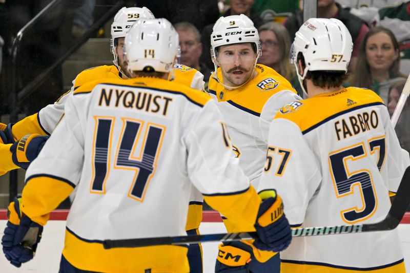 Jan 25, 2024; Saint Paul, Minnesota, USA; Nashville Predators forward Filip Forsberg (9) celebrates his goal against the Minnesota Wild with defenseman Roman Josi (59), forward Gustav Nyquist (14), and defenseman Dante Fabbro (57) during the third period at Xcel Energy Center. Mandatory Credit: Nick Wosika-USA TODAY Sports