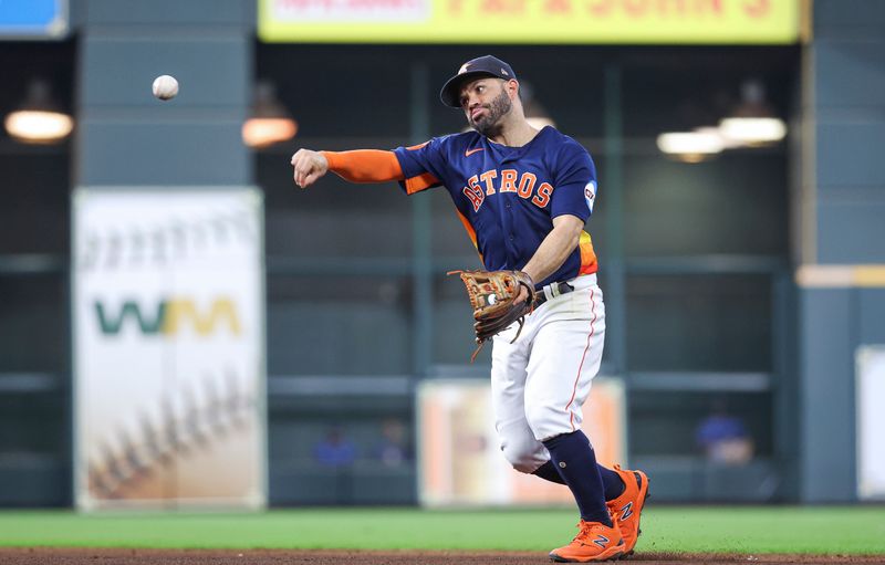 Sep 24, 2023; Houston, Texas, USA; Houston Astros second baseman Jose Altuve (27) throws out a runner at first base during the sixth inning against the Kansas City Royals at Minute Maid Park. Mandatory Credit: Troy Taormina-USA TODAY Sports