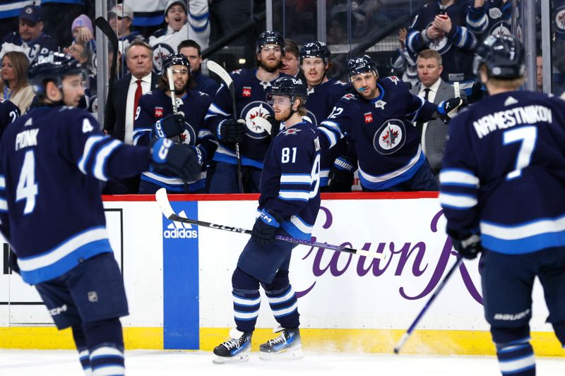 Mar 5, 2024; Winnipeg, Manitoba, CAN; Winnipeg Jets left wing Kyle Connor (81) celebrates his second period goal against the Seattle Kraken at Canada Life Centre. Mandatory Credit: James Carey Lauder-USA TODAY Sports