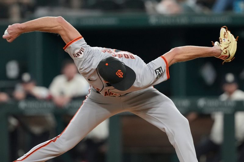 Jun 7, 2024; Arlington, Texas, USA; San Francisco Giants relief pitcher Tyler Rogers (71) delivers a pitch to the Texas Rangers during the eighth inning at Globe Life Field. Mandatory Credit: Jim Cowsert-USA TODAY Sports