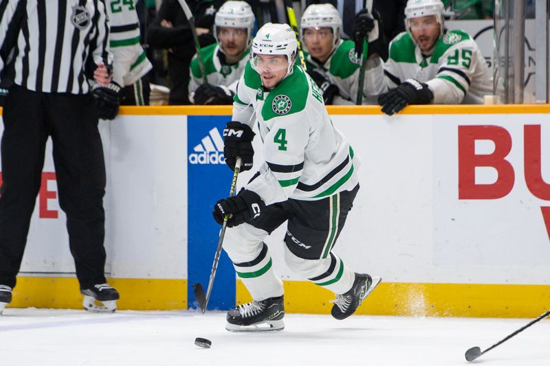 Feb 15, 2024; Nashville, Tennessee, USA; Dallas Stars defenseman Miro Heiskanen (4) skates with the puck  against the Nashville Predators during the second period at Bridgestone Arena. Mandatory Credit: Steve Roberts-USA TODAY Sports