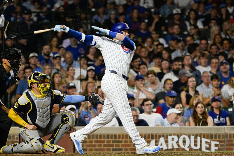 Jul 22, 2024; Chicago, Illinois, USA;  Chicago Cubs outfielder Ian Happ (8) hits a home run against the Milwaukee Brewers during the sixth inning at Wrigley Field. Mandatory Credit: Matt Marton-USA TODAY Sports