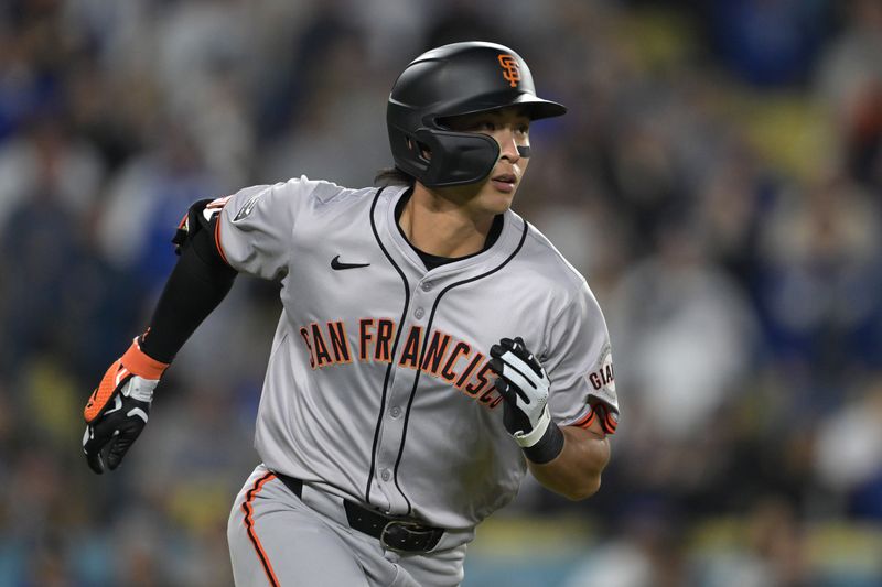 Apr 2, 2024; Los Angeles, California, USA;  San Francisco Giants center fielder Jung Hoo Lee (51) singles in the ninth inning against the Los Angeles Dodgers at Dodger Stadium. Mandatory Credit: Jayne Kamin-Oncea-USA TODAY Sports