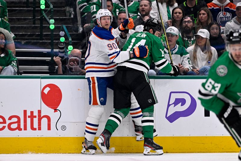 May 23, 2025; Dallas, Texas, USA; Edmonton Oilers right wing Corey Perry (90) checks Dallas Stars left wing Jamie Benn (14) in the second period for game two of the Western Conference Final of the 2025 Stanley Cup Playoffs at American Airlines Center. Mandatory Credit: Jerome Miron-Imagn Images