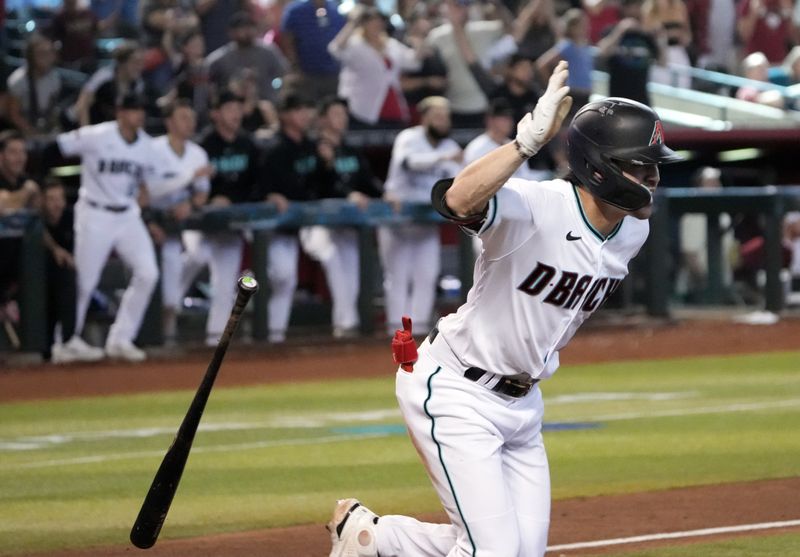 Jul 8, 2023; Phoenix, Arizona, USA; Arizona Diamondbacks left fielder Corbin Carroll (7) celebrates after hitting a walk off RBI single against the Pittsburgh Pirates during the tenth inning at Chase Field. Mandatory Credit: Joe Camporeale-USA TODAY Sports