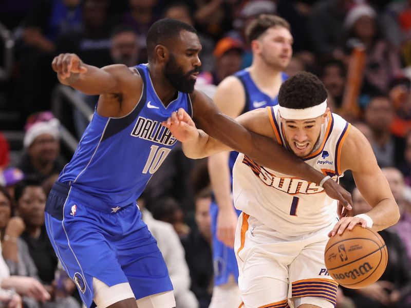 PHOENIX, ARIZONA - DECEMBER 25: Devin Booker #1 of the Phoenix Suns is fouled by Tim Hardaway Jr. #10 of the Dallas Mavericks during the second half of the NBA game at Footprint Center on December 25, 2023 in Phoenix, Arizona. The Mavericks defeated the Suns 128-114. NOTE TO USER: User expressly acknowledges and agrees that, by downloading and or using this photograph, User is consenting to the terms and conditions of the Getty Images License Agreement.  (Photo by Christian Petersen/Getty Images)