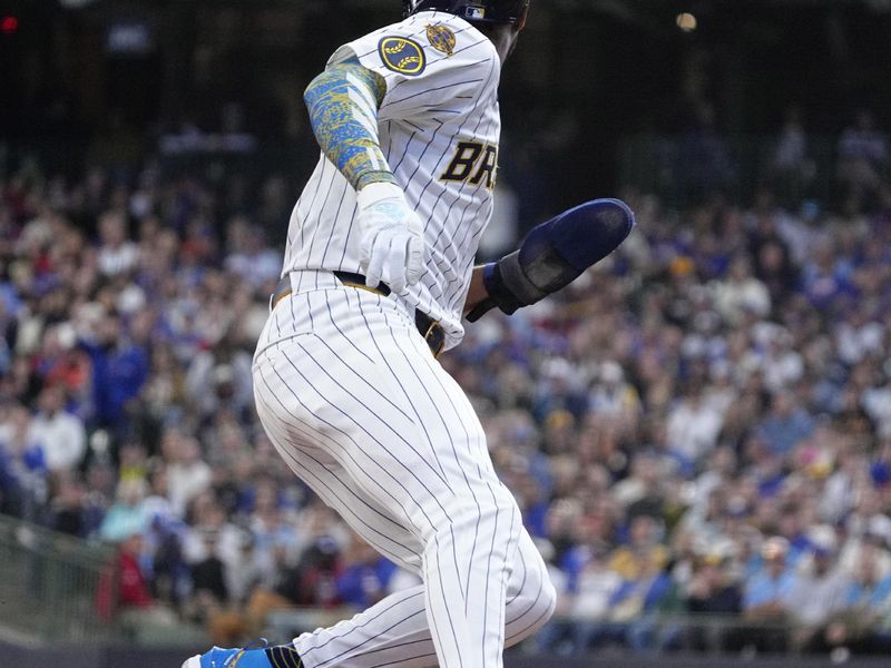 May 4, 2025; Milwaukee, Wisconsin, USA; Milwaukee Brewers outfielder Jackson Chourio (11) holds up on third base against the Chicago Cubs in the fifth inning at American Family Field. Mandatory Credit: Michael McLoone-Imagn Images