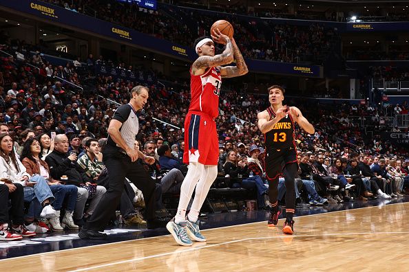 WASHINGTON, DC -? DECEMBER 31: Kyle Kuzma #33 of the Washington Wizards shoots a three point basket during the game against the Atlanta Hawks on December 31, 2023 at Capital One Arena in Washington, DC. NOTE TO USER: User expressly acknowledges and agrees that, by downloading and or using this Photograph, user is consenting to the terms and conditions of the Getty Images License Agreement. Mandatory Copyright Notice: Copyright 2023 NBAE (Photo by Kenny Giarla/NBAE via Getty Images)