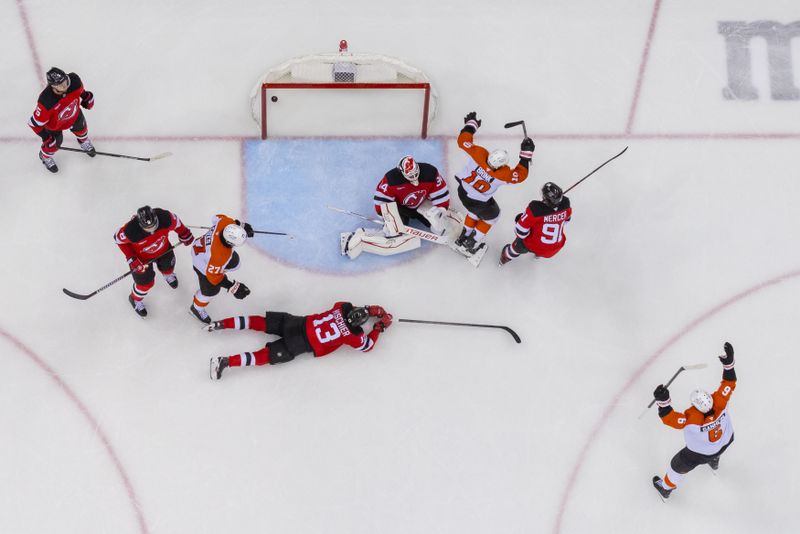 Jan 18, 2025; Newark, New Jersey, USA; Philadelphia Flyers right wing Bobby Brink (10) celebrates his goal against the New Jersey Devils during the third period at Prudential Center. Mandatory Credit: Ed Mulholland-Imagn Images