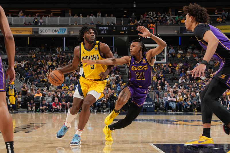 INDIANAPOLIS, IN - MARCH 29: T.J. McConnell #9 of the Indiana Pacers dribbles the ball during the game against the Los Angeles Lakers on March 24, 2024 at Gainbridge Fieldhouse in Indianapolis, Indiana. NOTE TO USER: User expressly acknowledges and agrees that, by downloading and or using this Photograph, user is consenting to the terms and conditions of the Getty Images License Agreement. Mandatory Copyright Notice: Copyright 2024 NBAE (Photo by Jesse D. Garrabrant /NBAE via Getty Images)