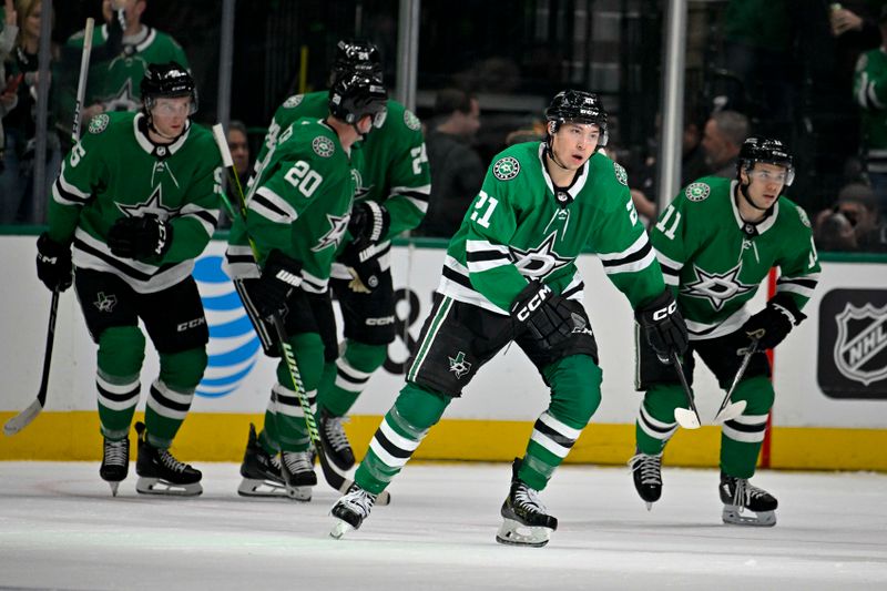 Apr 22, 2024; Dallas, Texas, USA; Dallas Stars defenseman Ryan Suter (20) and center Roope Hintz (24) and center Logan Stankoven (11) and left wing Jason Robertson (21) celebrates a goal scored by Robertson against the Vegas Golden Knights during the first period in game one of the first round of the 2024 Stanley Cup Playoffs at the American Airlines Center. Mandatory Credit: Jerome Miron-USA TODAY Sports