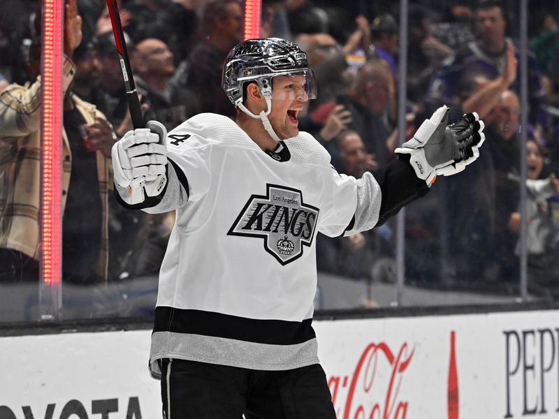 Apr 10, 2023; Los Angeles, California, USA;  Los Angeles Kings right wing Arthur Kaliyev (34) celebrates after scoring a goal in the second period against the Vancouver Canucks at Crypto.com Arena. Mandatory Credit: Jayne Kamin-Oncea-USA TODAY Sports