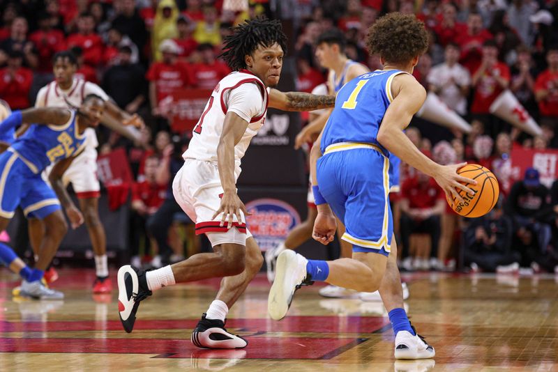 Jan 13, 2025; Piscataway, New Jersey, USA; Rutgers Scarlet Knights guard Jamichael Davis (1) guards UCLA Bruins guard Trent Perry (1) during the second half at Jersey Mike's Arena. Mandatory Credit: Vincent Carchietta-Imagn Images