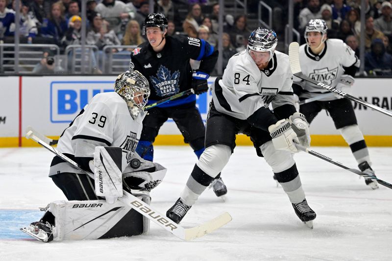 Jan 2, 2024; Los Angeles, California, USA; Los Angeles Kings goaltender Pheonix Copley (29) makes a save as Los Angeles Kings defenseman Vladislav Gavrikov (84) look on during the third period against the Toronto Maple Leafs at Crypto.com Arena. Mandatory Credit: Jayne Kamin-Oncea-USA TODAY Sports