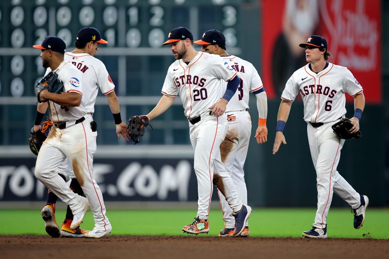 Aug 18, 2024; Houston, Texas, USA; Houston Astros players congratulate each other after the final out against the Chicago White Sox during the ninth inning at Minute Maid Park. Mandatory Credit: Erik Williams-USA TODAY Sports