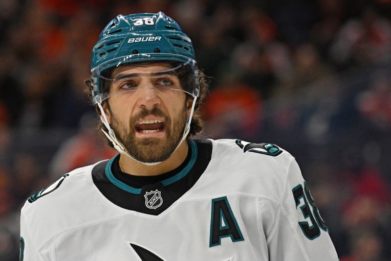Dec 9, 2025; Philadelphia, Pennsylvania, USA; San Jose Sharks defenseman Mario Ferraro (38) against the Philadelphia Flyers during the first period at Xfinity Mobile Arena. Mandatory Credit: Eric Hartline-Imagn Images