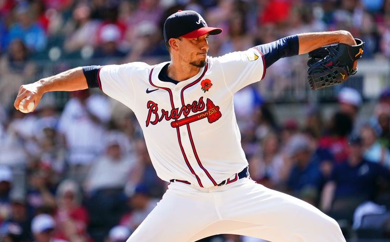 May 27, 2024; Cumberland, Georgia, USA; Atlanta Braves pitcher Charlie Morton (50) pitching against the Washington Nationals during the third inning at Truist Park. Mandatory Credit: John David Mercer-USA TODAY Sports