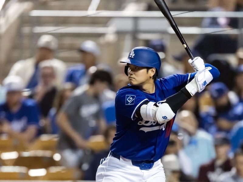 Feb 28, 2025; Phoenix, Arizona, USA; Los Angeles Dodgers designated hitter Shohei Ohtani (17) against the Los Angeles Angels during a spring training game at Camelback Ranch-Glendale. Mandatory Credit: Mark J. Rebilas-Imagn Images