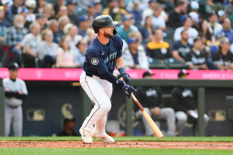 Jun 10, 2024; Seattle, Washington, USA; Seattle Mariners designated hitter Mitch Haniger (17) hits a double against the Chicago White Sox during the second inning at T-Mobile Park. Mandatory Credit: Steven Bisig-USA TODAY Sports