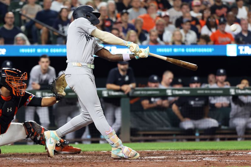 Sep 19, 2025; Baltimore, Maryland, USA; New York Yankees second baseman Jazz Chisholm Jr. (13) hits a home run during the seventh inning against the Baltimore Orioles at Oriole Park at Camden Yards. Mandatory Credit: Daniel Kucin Jr.-Imagn Images