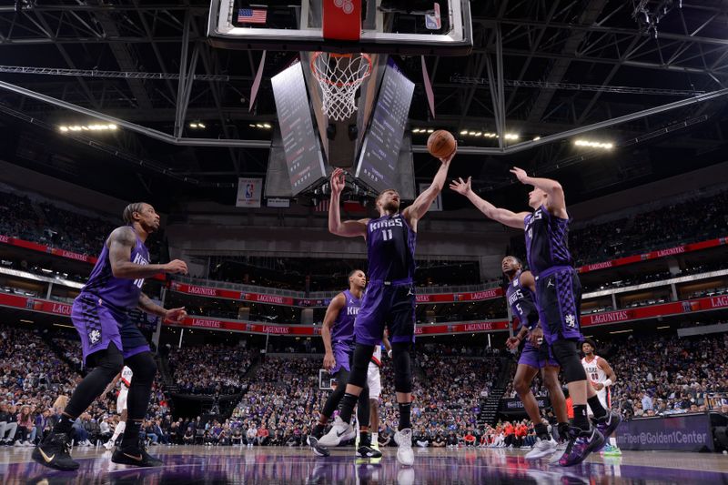 SACRAMENTO, CA - OCTOBER 28: Domantas Sabonis #11 of the Sacramento Kings goes up for the rebound during the game against the Portland Trail Blazers on October 28, 2024 at Golden 1 Center in Sacramento, California. NOTE TO USER: User expressly acknowledges and agrees that, by downloading and or using this Photograph, user is consenting to the terms and conditions of the Getty Images License Agreement. Mandatory Copyright Notice: Copyright 2024 NBAE (Photo by Rocky Widner/NBAE via Getty Images)