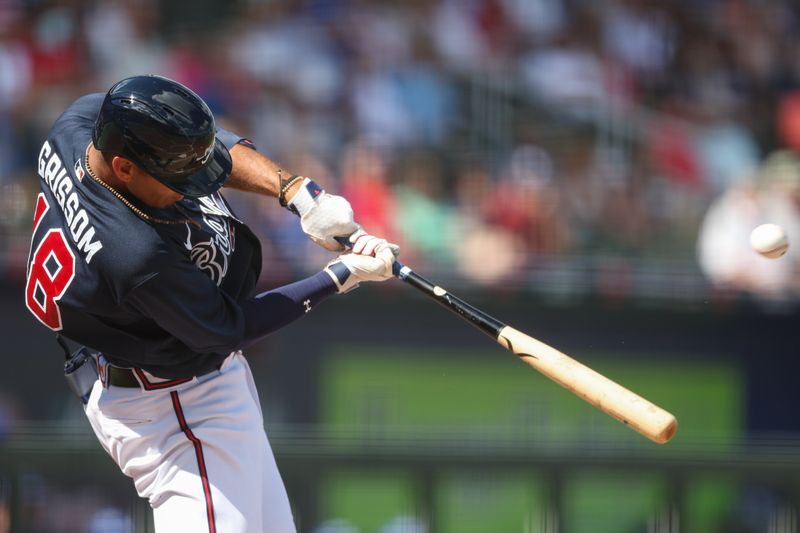 Feb 27, 2023; North Port, Florida, USA;  Atlanta Braves second baseman Vaughn Grissom (18) hits a sacrifice fly for an rbi against the Toronto Blue Jays in the third inning during spring training at CoolToday Park. Mandatory Credit: Nathan Ray Seebeck-USA TODAY Sports