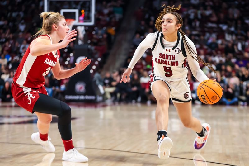 uFeb 22, 2024; Columbia, South Carolina, USA; South Carolina Gamecocks guard Tessa Johnson (5) drives around Alabama Crimson Tide guard Sarah Ashlee Barker (3) in the first half at Colonial Life Arena. Mandatory Credit: Jeff Blake-USA TODAY Sports