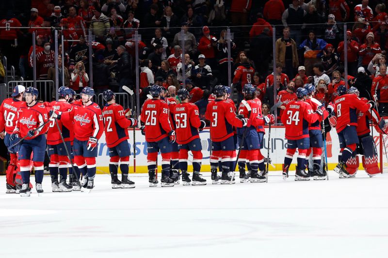Jan 5, 2026; Washington, District of Columbia, USA; Washington Capitals goaltender Charlie Lindgren (79) celebrates with teammates after heir game against the Anaheim Ducks at Capital One Arena. Mandatory Credit: Geoff Burke-Imagn Images