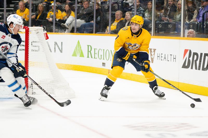 Nov 23, 2024; Nashville, Tennessee, USA;  Nashville Predators defenseman Marc Del Gaizo (7) skates behind the net against the Winnipeg Jets during the first period at Bridgestone Arena. Mandatory Credit: Steve Roberts-Imagn Images