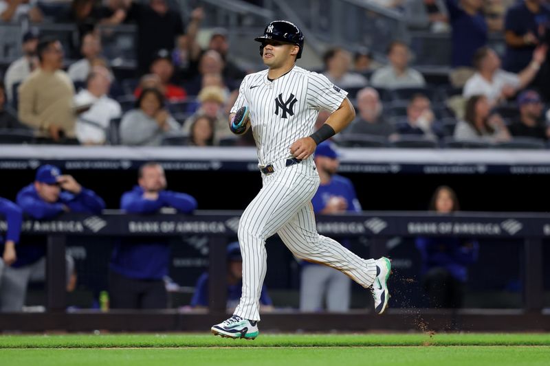 Sep 9, 2024; Bronx, New York, USA; New York Yankees center fielder Jasson Dominguez (89) scores a run against the Kansas City Royals on a throwing error by Royals catcher Salvador Perez (not pictured) after stealing third base during the fourth inning at Yankee Stadium. Mandatory Credit: Brad Penner-Imagn Images