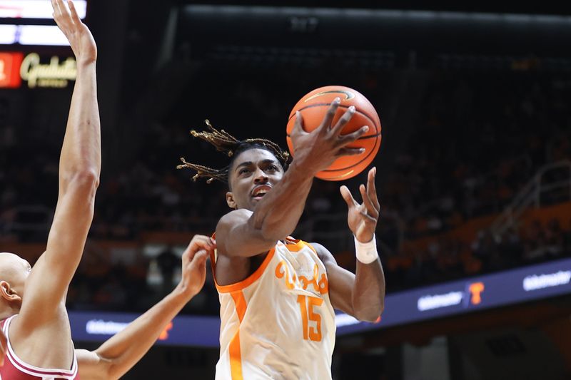 Feb 28, 2023; Knoxville, Tennessee, USA; Tennessee Volunteers guard Jahmai Mashack (15) goes to the basket against Arkansas Razorbacks guard Jordan Walsh (13) during the second half at Thompson-Boling Arena. Mandatory Credit: Randy Sartin-USA TODAY Sports