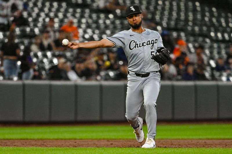 Sep 3, 2024; Baltimore, Maryland, USA;  Chicago White Sox third base Lenyn Sosa (50) throws to first base ion Baltimore Orioles third base Emmanuel Rivera (top pic) third inning ground ball at Oriole Park at Camden Yards. Mandatory Credit: Tommy Gilligan-Imagn Images