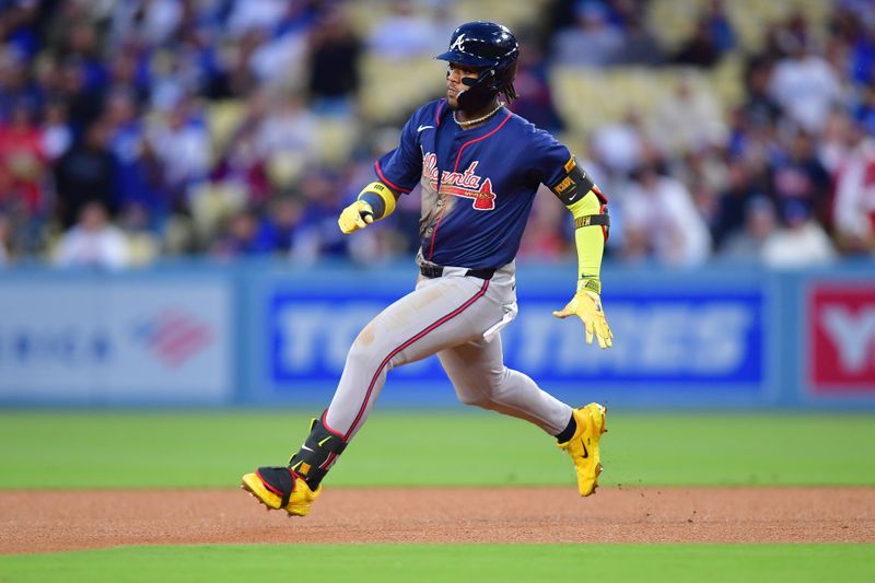 May 4, 2024; Los Angeles, California, USA; Atlanta Braves right fielder Ronald Acuña Jr. (13) reaches second on a double against the Los Angeles Dodgers during the sixth inning at Dodger Stadium. Mandatory Credit: Gary A. Vasquez-USA TODAY Sports