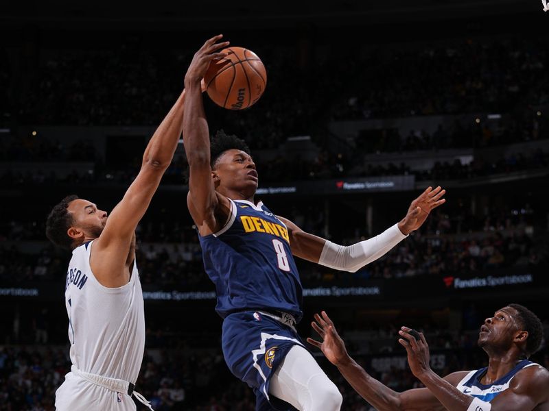 DENVER, CO - APRIL 10: Kyle Anderson #1 of the Minnesota Timberwolves blocks the shot by Peyton Watson #8 of the Denver Nuggets during the game on April 10, 2024 at the Ball Arena in Denver, Colorado. NOTE TO USER: User expressly acknowledges and agrees that, by downloading and/or using this Photograph, user is consenting to the terms and conditions of the Getty Images License Agreement. Mandatory Copyright Notice: Copyright 2024 NBAE (Photo by Bart Young/NBAE via Getty Images)