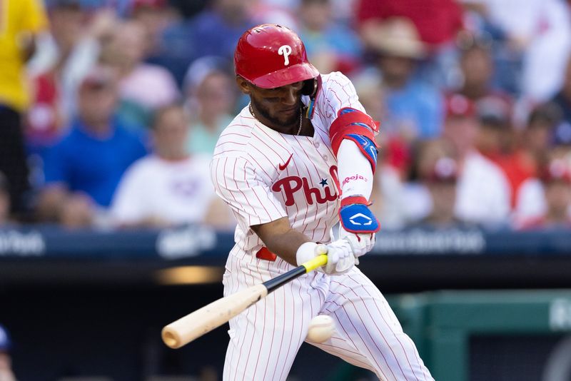 Jul 9, 2024; Philadelphia, Pennsylvania, USA; Philadelphia Phillies outfielder Johan Rojas (18) hits a single during the second inning against the Los Angeles Dodgers at Citizens Bank Park. Mandatory Credit: Bill Streicher-USA TODAY Sports