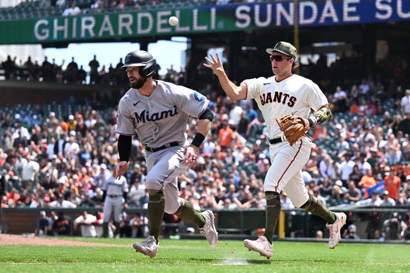 May 21, 2023; San Francisco, California, USA; San Francisco Giants infielder Casey Schmitt (6) chases Miami Marlins infielder Jon Berti (5) in a rundown play during the fifth inning at Oracle Park. Mandatory Credit: Robert Edwards-USA TODAY Sports