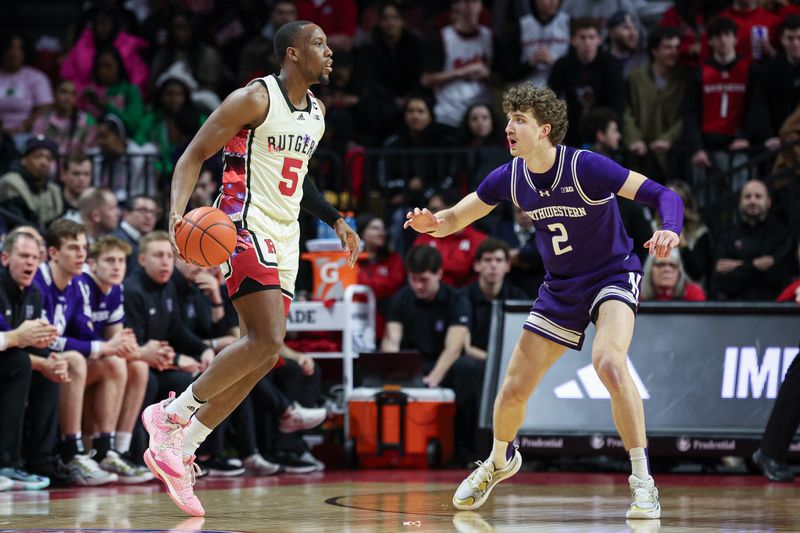 Feb 15, 2024; Piscataway, New Jersey, USA; Rutgers Scarlet Knights forward Aundre Hyatt (5) dribbles against Northwestern Wildcats forward Nick Martinelli (2) during the first half at Jersey Mike's Arena. Mandatory Credit: Vincent Carchietta-USA TODAY Sports