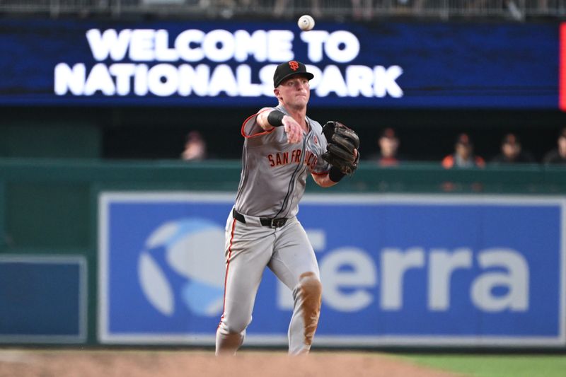 Aug 5, 2024; Washington, District of Columbia, USA; San Francisco Giants center fielder Tyler Fitzgerald (49) throws to first base against the Washington Nationals during the fifth inning at Nationals Park. Mandatory Credit: Rafael Suanes-USA TODAY Sports