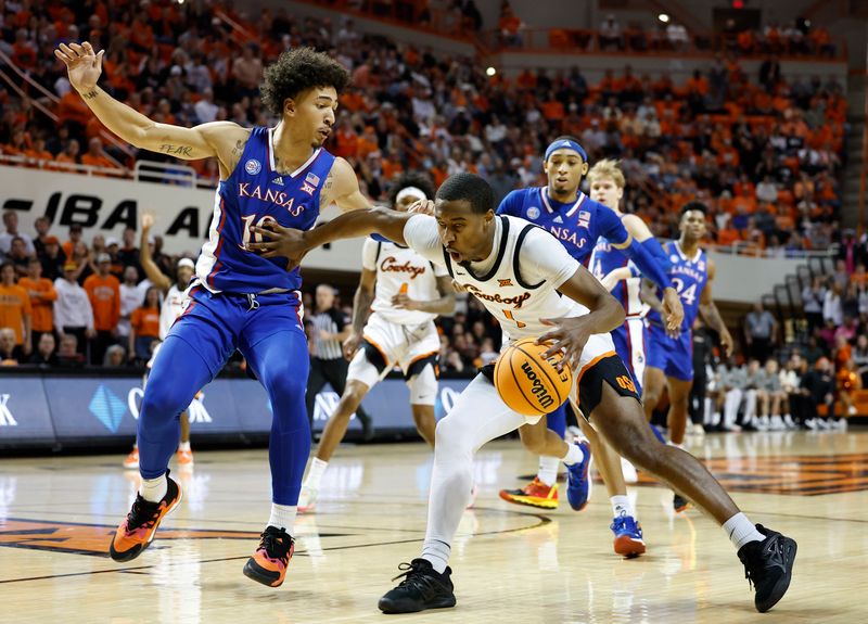 Feb 14, 2023; Stillwater, Oklahoma, USA; Oklahoma State Cowboys guard Bryce Thompson (1) drives against Kansas Jayhawks forward Jalen Wilson (10) during the first half at Gallagher-Iba Arena. Mandatory Credit: Alonzo Adams-USA TODAY Sports