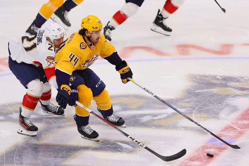 Mar 21, 2024; Sunrise, Florida, USA; Nashville Predators left wing Kiefer Sherwood (44) moves the puck past Florida Panthers center Nick Cousins (21) during the third period at Amerant Bank Arena. Mandatory Credit: Sam Navarro-USA TODAY Sports