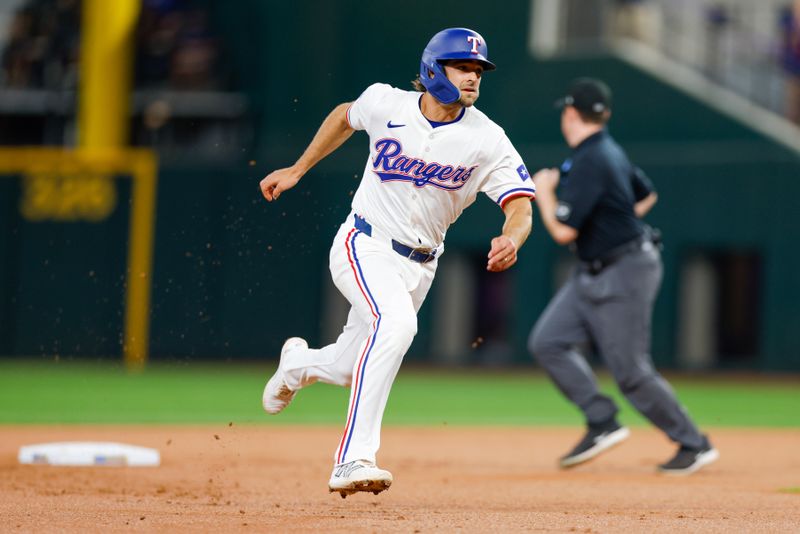 Jul 23, 2024; Arlington, Texas, USA; Texas Rangers third base Josh Smith (8) heads to third base during the first inning against the Chicago White Sox at Globe Life Field. Mandatory Credit: Andrew Dieb-USA TODAY Sports