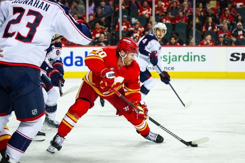 Dec 3, 2024; Calgary, Alberta, CAN; Calgary Flames center Blake Coleman (20) controls the puck against the Columbus Blue Jackets during the second period at Scotiabank Saddledome. Mandatory Credit: Sergei Belski-Imagn Images