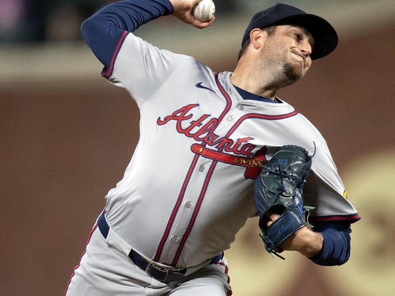 Aug 14, 2024; San Francisco, California, USA; Atlanta Braves pitcher Luke Jackson (22) delivers a pitch against the San Francisco Giants during the eighth inning at Oracle Park. Mandatory Credit: D. Ross Cameron-USA TODAY Sports