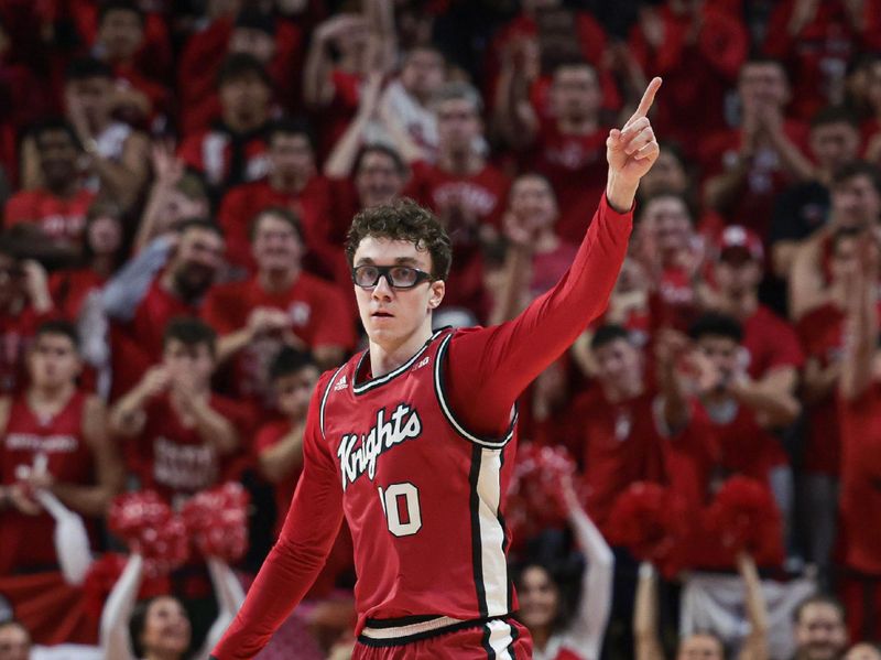 Dec 2, 2023; Piscataway, New Jersey, USA; Rutgers Scarlet Knights guard Gavin Griffiths (10) reacts after making a three point basket against the Illinois Fighting Illini during the second half at Jersey Mike's Arena. Mandatory Credit: Vincent Carchietta-USA TODAY Sports