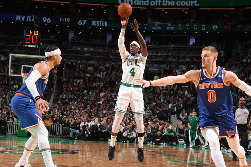 BOSTON, MA - APRIL 11: Jrue Holiday #4 of the Boston Celtics shoots the ball during the game against the New York Knicks on April 11, 2024 at the TD Garden in Boston, Massachusetts. NOTE TO USER: User expressly acknowledges and agrees that, by downloading and or using this photograph, User is consenting to the terms and conditions of the Getty Images License Agreement. Mandatory Copyright Notice: Copyright 2024 NBAE  (Photo by Nathaniel S. Butler/NBAE via Getty Images)