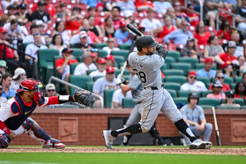 May 4, 2024; St. Louis, Missouri, USA;  Chicago White Sox right fielder Tommy Pham (28) hits a go-ahead one run single against the St. Louis Cardinals during the tenth inning at Busch Stadium. Mandatory Credit: Jeff Curry-USA TODAY Sports